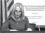  ?? J. SCOTT APPLEWHITE/AP ?? Rep. Mary Gay Scanlon, D-Pa., reads from special counsel Robert Mueller’s report Thursday at the Capitol.