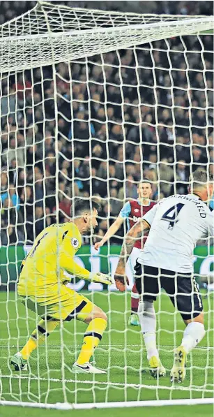  ??  ?? Demolition derby: Manuel Lanzini fires in West Ham’s winner from close range