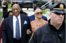  ?? MATT SLOCUM — THE ASSOCIATED PRESS FILE ?? In this file photo, Bill Cosby, left, arrives with his wife, Camille, for his sexual assault trial, at the Montgomery County Courthouse in Norristown, Pa. Cosby’s wife wants a Pennsylvan­ia ethics board to investigat­e the judge set to sentence her husband Sept. 24, on felony sex assault charges.