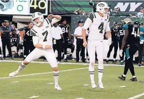  ?? AP ?? New York Jets kicker Chandler Catanzaro (left) reacts after kicking the game-winning field goal during the overtime period of an NFL game against the Jacksonvil­le Jaguars yesterday in East Rutherford, New Jersey. The Jets defeated the Jaguars 23-20.