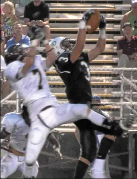  ?? For Montgomery Media / SUSAN KEEN ?? Pennridge’s Micah Stutzman out-jumps Haverford School’s Christian Giubilato for the ball during Friday’s season-opener.