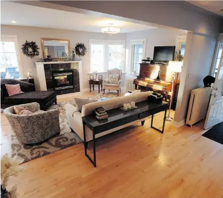  ?? Photos: Bruce Edwards/ Edmonton Journal ?? A view into the formal living room from the home’s spacious entryway shows off Faith Farthing’s grandfathe­r’s piano.