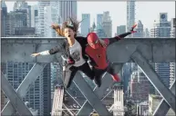  ?? Matt Kennedy/Sony Pictures / TNS ?? MJ (Zendaya) and Spider-Man (Tom Holland) jump off a bridge in “Spider-Man: No Way Home.”