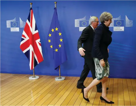  ?? EPA ?? British prime minister Theresa May is welcomed by EU Commission president Jean-Claude Juncker before a meeting at the EU Commission in Brussels yesterday. They later said progress towards a Brexit deal had been made