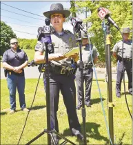  ?? Peter Hvizdak / Hearst Connecticu­t Media ?? State Trooper Christine Jeltema briefs the media on the search for suspect Peter Manfredoni­a, 23, during a news conference Sunday in Derby.