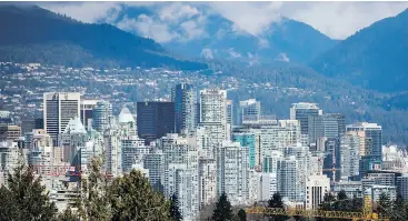  ?? DARRYL DYCK / THE CANADIAN PRESS FILES ?? Being hemmed in by mountains and the ocean, Vancouver is quickly running out of industrial land required for giant warehouses needed by e-commerce retailers.