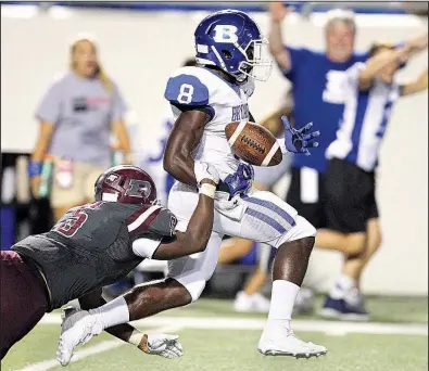  ?? Arkansas Democrat-Gazette/THOMAS METTHE ?? Benton linebacker Kyvin Carroll strips the ball from Bryant wide receiver Ja’kalon Pittman during the fourth quarter of Saturday night’s Salt Bowl at War Memorial Stadium in Little Rock. Bryant won 49-42 before an announced crowd of more than 32,000....