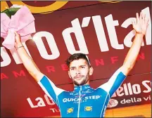  ??  ?? Colombia’s Fernando Gaviria of team Quick-Step celebrates on the podium after winning the 5th stage of the 100th Giro d’Italia, Tour of Italy,cycling race from Pedara to Messina on May 10. (AFP)
