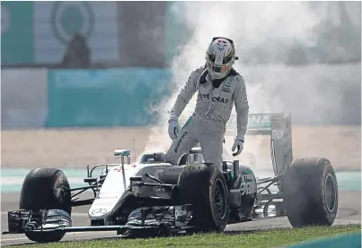  ?? Picture: AP. ?? A disgruntle­d Lewis Hamilton retires from the Malaysian Grand Prix.