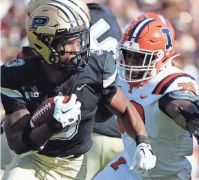  ?? ALEX MARTIN/JOURNAL AND COURIER ?? Purdue running back Tyrone Tracy Jr. rushes the ball against Illinois on Sept. 30 at Ross-Ade Stadium in West Lafayette. Purdue Boilermake­rs won 44-19.