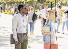  ?? Justin Lubin / NBC ?? In “The Good Place,” some have found comfort in rewatching William Jackson Harper’s Chidi strike up a relationsh­ip with Kristen Bell as Eleanor.