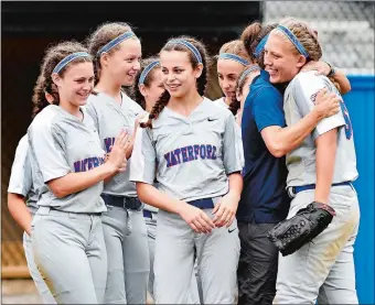  ?? SEAN D. ELLIOT/THE DAY ?? Waterford’s Jennie Sherwood, right, is embraced by manager Becky Hall after recording the final out in a 6-2 win over Robbinsvil­le (N.J.) in East Regional Little League (11-12) softball tournament on Tuesday in Bristol. The Connecticu­t champions...