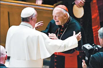  ?? JONATHAN NEWTON/THE WASHINGTON POST ?? Pope Francis, left, is seen in 2015 with Cardinal Theodore McCarrick, who faces allegation­s he sexually abused boys and adults. Francis ordered him suspended “from the ... ministry.”