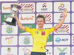  ?? ?? FLYING DUTCHMAN: Roojai Insurance’s Adne Van Engelen poses on the podium with the trophy yesterday.