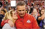  ?? SAM RICHE / TNS 2017 ?? “I eagerly look forward to the resolution of this matter,” says Ohio State coach Urban Meyer, with his wife, Shelley. Meyer was placed on paid administra­tive leave Wednesday.