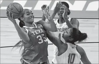  ?? AP FILE PHOTO ?? Texas’s Charli Collier, left, was selected No. 1 overall by the Dallas Wings in Thursday’s WNBA Draft.