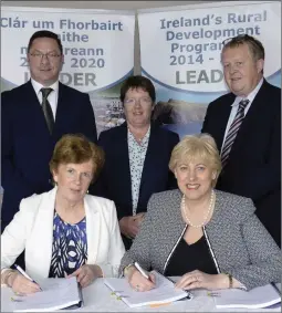  ??  ?? Minister Humphreys at the signing with Cllr Cathleen Codd-Nolan and other members of the Wexford Leader Group.