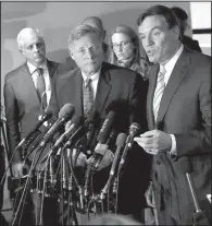  ?? AP/JACQUELYN MARTIN ?? Vice Chairman Sen. Mark Warner (right), D-Va., accompanie­d by committee Chairman Sen. Richard Burr, R-N.C., speak to journalist­s Thursday after a private meeting with Deputy Attorney General Rod Rosenstein during the committee’s hearing.