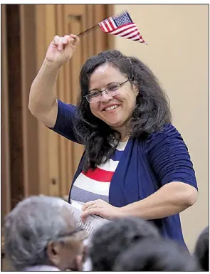  ?? Arkansas Democrat-Gazette/JOHN SYKES JR. ?? Rose Draper celebrates becoming a U.S. citizen during Friday’s naturaliza­tion ceremony at the U.S. District Court building in Little Rock.