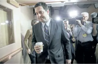  ?? J. SCOTT APPLEWHITE/THE ASSOCIATED PRESS ?? House Intelligen­ce Committee chairman Rep. Devin Nunes, R-Calif is pursued by reporters as he arrives for a weekly meeting of the Republican Conference with House Speaker Paul Ryan and the GOP leadership on Tuesday.