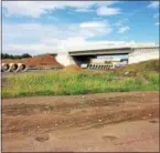  ?? EVAN BRANDT — DIGITAL FIRST MEDIA ?? In a legal proceeding filed July 26, the owners of the Universal Concrete plant property, seen beyond the new Route 422 Stowe interchang­e bridge now under constructi­on, contend $1.8 million is inadequate to compensate for the state’s condemnati­on and taking of 40 acres of land.