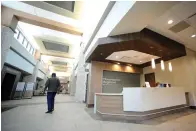  ?? The Associated Press ?? ■ A man walks through the lobby of Thomasvill­e Regional Medical Center in Thomasvill­e, Ala., on May 3. The hospital is among three in the nation that say they are missing out on federal pandemic relief money because they opened during or shortly before the COVID-19 crisis began.