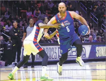  ?? ROB GRAY Associated Press ?? ALBERT PUJOLS hits a burst of speed to drive past rapper 21 Savage in the NBA All-Star Celebrity Game on Friday. It’s one of the fun trips Pujols has taken with family since he doesn’t have to prepare to play baseball.