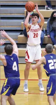  ?? PILOT PHOTO/RUDY MARQUEZ ?? Plymouth’s Owen Yoder gets this shot off before Triton defenders Hunter Mcintyre (4) and Bruce Johnson (22) can get there.