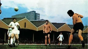  ?? ?? Frank Munro heads a Wolves goal from the edge of the six-yard box to help see off Ferencvaro­s, 1972