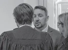  ?? ?? Doug Snelgrove speaks with his lawyer Owen Goddard during a break in proceeding­s at the Newfoundla­nd and Labrador Court of Appeal Thursday, Nov. 4, 2022.