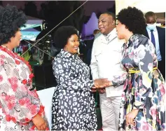  ?? ?? First Lady Dr Auxillia Mnangagwa shares a lighter moment with Vice President Dr Constantin­o Chiwenga and his wife Colonel Miniyothab­o Baloyi-Chiwenga who were dressed in the yesteryear fashion style during the fundraisin­g dinner at State House on Friday