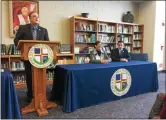  ?? MEDIANEWS GROUP FILE PHOTO ?? Former Pope John Paul II President Jason B. Bozzone, left, welcomes state Rep. Marcy Toepel and Montgomery County Commission­er Joe Gale in 2018.