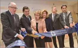  ?? Dan Watson/The Signal ?? Henry Mayo Newhall Hospital President and CEO Roger Seaver, left, is joined by Craig Peters, Judy Fish, Marlee Lauffer, Don Kimball and Dr. Don Nishiguchi as they cut the ribbon at the unveiling ceremony of the the new Henry Mayo Newhall Hospital Patient Tower in Valencia on Thursday.