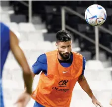  ?? — AFP photo ?? Giroud heads the ball during a training session.