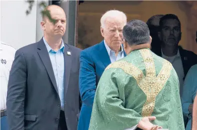  ?? ALEX BRANDON/AP ?? President Joe Biden speaks with a priest at St. Joseph on the Brandywine Catholic Church in Wilmington, Delaware.