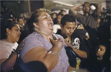  ?? Patrick T. Fallon Los Angeles Times ?? GENEVIEVE HUIZAR, pictured in 2012 mourning the loss of her son, was moved to tears of joy by the news that “she has a second chance to get justice for” him, lawyer Melanie Partow said after Wednesday’s decision.