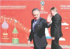  ??  ?? ST PETERSBURG: A file picture taken on July 25, 2015 shows Russian Sports Minister Vitaly Mutko (L) arriving to attend the preliminar­y draw for the 2018 World Cup qualifiers at the Konstantin Palace in Saint Petersburg. Russia yesterday pledged to cooperate with anti-doping and internatio­nal athletics authoritie­s after a damning report into allegation­s of doping and corruption in athletics in the country.