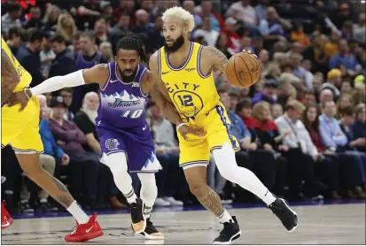  ?? PHOTOS BY RICK BOWMER — THE ASSOCIATED PRESS ?? Golden State Warriors guard Ky Bowman drives as Utah Jazz guard Mike Conley defends in the first half on Friday in Salt Lake City.