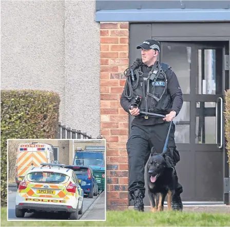  ??  ?? Police dog units search properties in the St Mary’s area of Dundee yesterday.