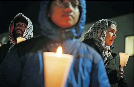  ?? ALEX WONG/GETTY IMAGES ?? A candleligh­t vigil marking last week’s mass shooting in San Bernardino, Calif., was held by the Council on American-Islamic Relations Friday.
