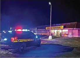  ?? ALISSA WIDMAN NEESE / COLUMBUS DISPATCH ?? A Franklin County Sheriff’s Office vehicle waits outside of the Dollar General located at 5001 Chatterton Road on the southeast side of Columbus after a shooting occurred in the parking lot Saturday night.