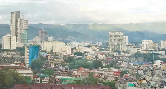  ?? SUNSTAR FOTO / ALLAN CUIZON ?? SIGNS OF PROGRESS. High-rise buildings have sprouted all over Metro Cebu, but local fire officials are ill-equipped to handle catastroph­es should any of the higher levels catch fire.