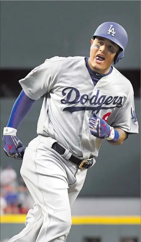  ?? Wally Skalij Los Angeles Times By Andy McCullough ?? MANNY MACHADO rounds third base after hitting a three-run home run in the seventh inning of the Dodgers’ 6-2 National League Division Series-clinching victory over the Atlanta Braves. It was the shortstop’s second home run of the series.