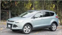  ?? CHRIS CHASE, SPECIAL TO THE GAZETTE ?? The 2013 Ford Escape SE 4WD, with various options including combined Cargo-management and Comfort packages, has an as-tested price of $35,979 a lot of money for a compact vehicle, but worth the price.