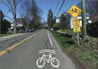  ??  ?? A bicycle lane on Rowayton Avenue in Norwalk on Tuesday.