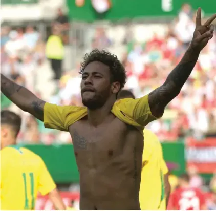  ??  ?? Neymar celebrates after scoring yesterday against Austria