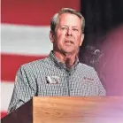  ?? DUSTIN CHAMBERS/REUTERS ?? Experts say measures passed by the state Legislatur­e and a signature from Gov. Brian Kemp, shown in 2022, could further hamper the way elections are run.