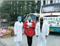  ??  ?? Top and above: Volunteer drivers transport supplies of donated medical materials to hospitals in Wuhan.