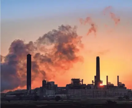  ?? J. DAVID AKE/AP ?? In this July 27, 2018, photo, the Dave Johnson coal-fired power plant is silhouette­d in Glenrock, Wyo.