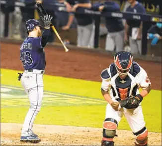  ?? GREGORY BULL Associated Press ?? MIKE BROSSEAU of Tampa Bay is upset after striking out on a 3- 2 pitch with the bases loaded to end the sixth inning, much to the delight of Houston catcher Martin Maldonado.